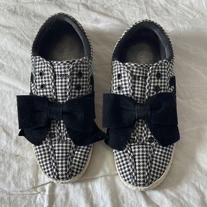 Black and white with a large black bow. slip on.